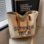 刺绣字母帆布包女2025新款 大容量通勤托特包百搭单肩大学生上课包