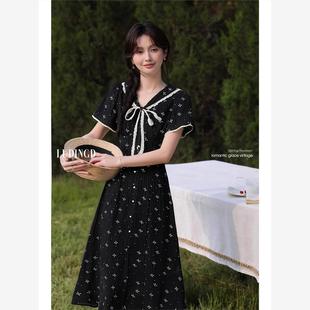 甜美系带碎花连衣裙女夏新款 法式 收腰遮肚娃娃领黑色蝴蝶结中长裙