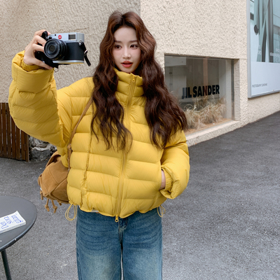 姜黄色潮流时尚90白鸭绒外套女2025年冬季新款加厚保暖立领羽绒服