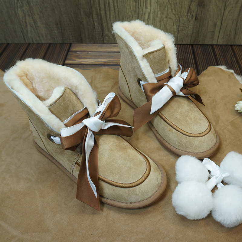 真皮一体丝带毛球橡胶底雪地靴