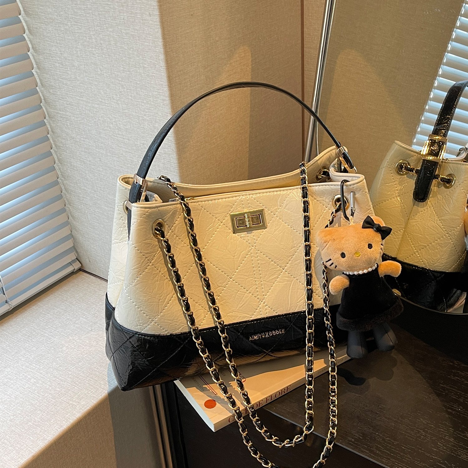 艾米兔女包2026新款简约洋气小众通勤休闲学院百搭手提单肩斜挎包