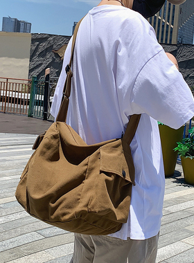 日系复古帆布包男生休闲大容量斜挎包ins潮牌单肩包女通勤邮差包