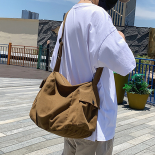 日系复古帆布包男生休闲大容量斜挎包ins潮牌单肩包女通勤邮差包
