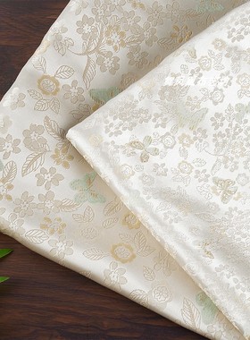 浅黄色 蝴蝶花卉织锦缎提花面料 新中式外套马甲丝滑光泽服装布料