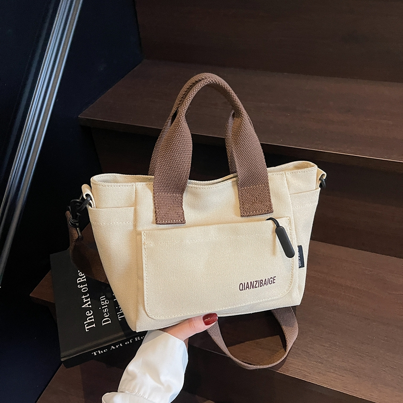 韩版简约菜篮子手提包包2025新款印花字母宽肩带帆布包百搭单肩包