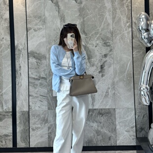 南油针织衫女早春2026新款浅蓝色圆领开衫字母镂空插肩袖毛衣外套