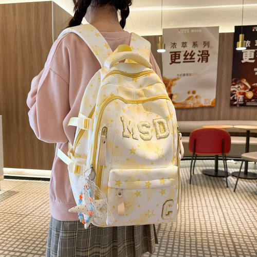 法国DUDK设计感高颜值双肩包女新款轻便护脊减负学生书包旅行背包