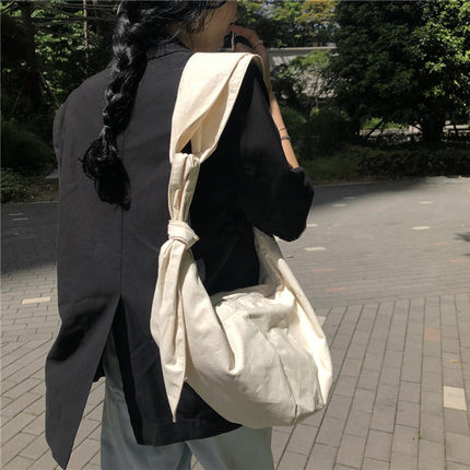 2020韩国东大门包包ins慵懒风帆布袋文艺打结饺子包单肩斜跨女包