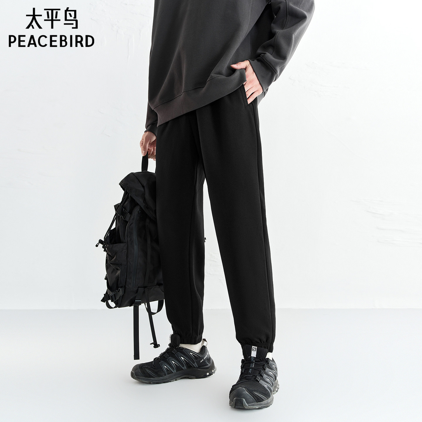 太平鸟男装休闲裤冬季锥形束脚裤后袋刺绣黑色百搭质感卫裤男