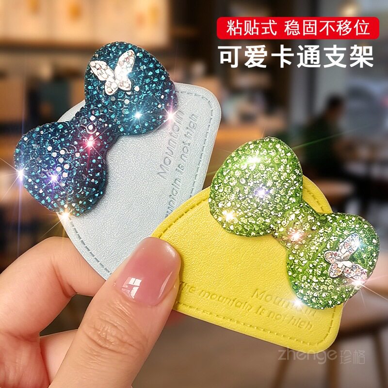 超好看蝴蝶结手机支架时尚女士便携防掉懒人桌面支撑牢固小众隐形吸附伸缩手机壳背贴可爱办公室追剧神器新款
