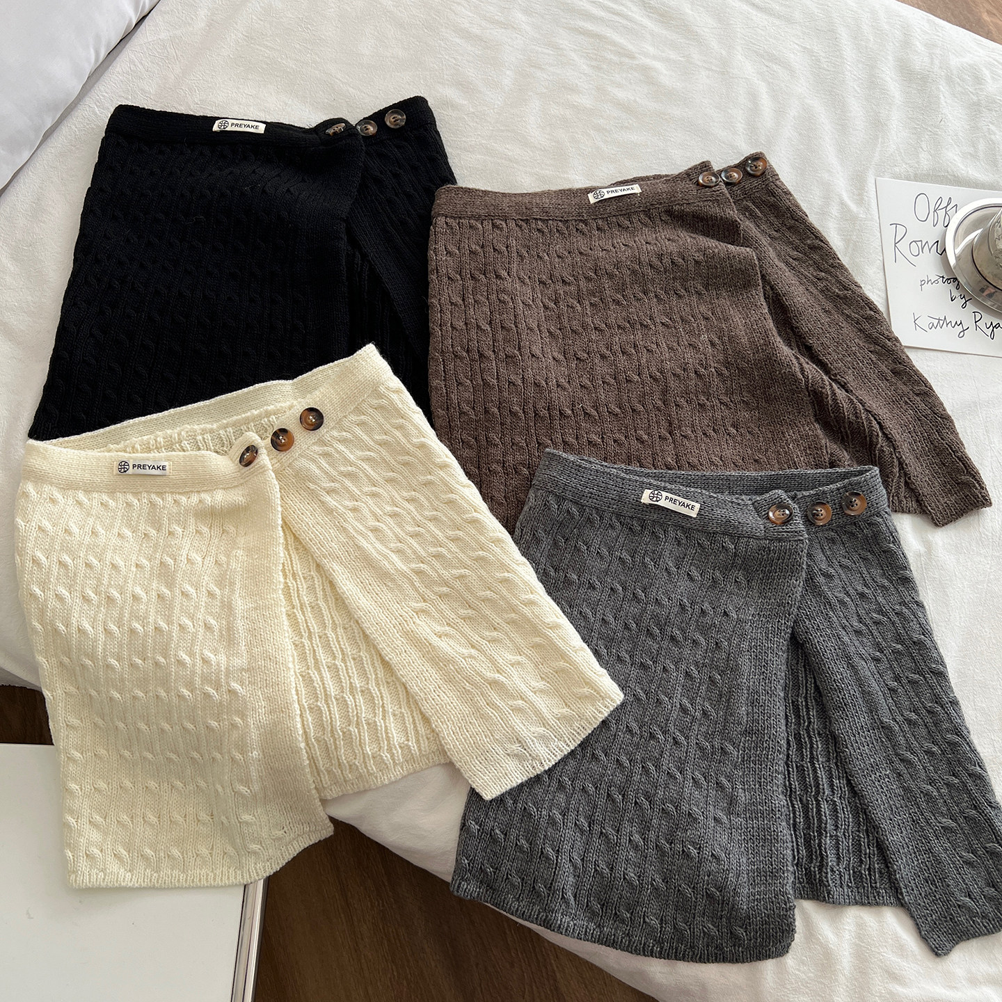 韩国时尚纽扣麻花针织屁帘女半身裙百搭叠穿打底藏肉围腰2026新款