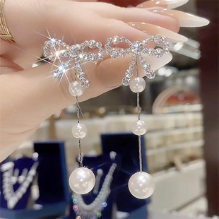 2025年夏季新款气质蝴蝶结珍珠耳环女长款显脸瘦耳坠轻奢流苏耳饰