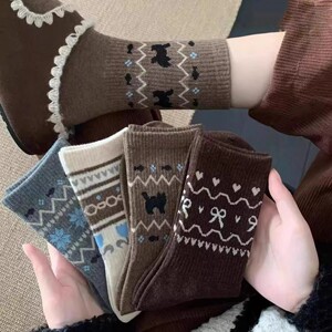 秋冬保暖加厚民族风费尔岛袜子女新款堆堆袜中筒袜ins风百搭袜