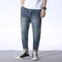 Mùa thu quần jeans nam thanh niên rộng chân retro quần harem khâu đàn hồi màu sắc kích thước lớn quần nam thủy triều - Quần jean quần jean nam