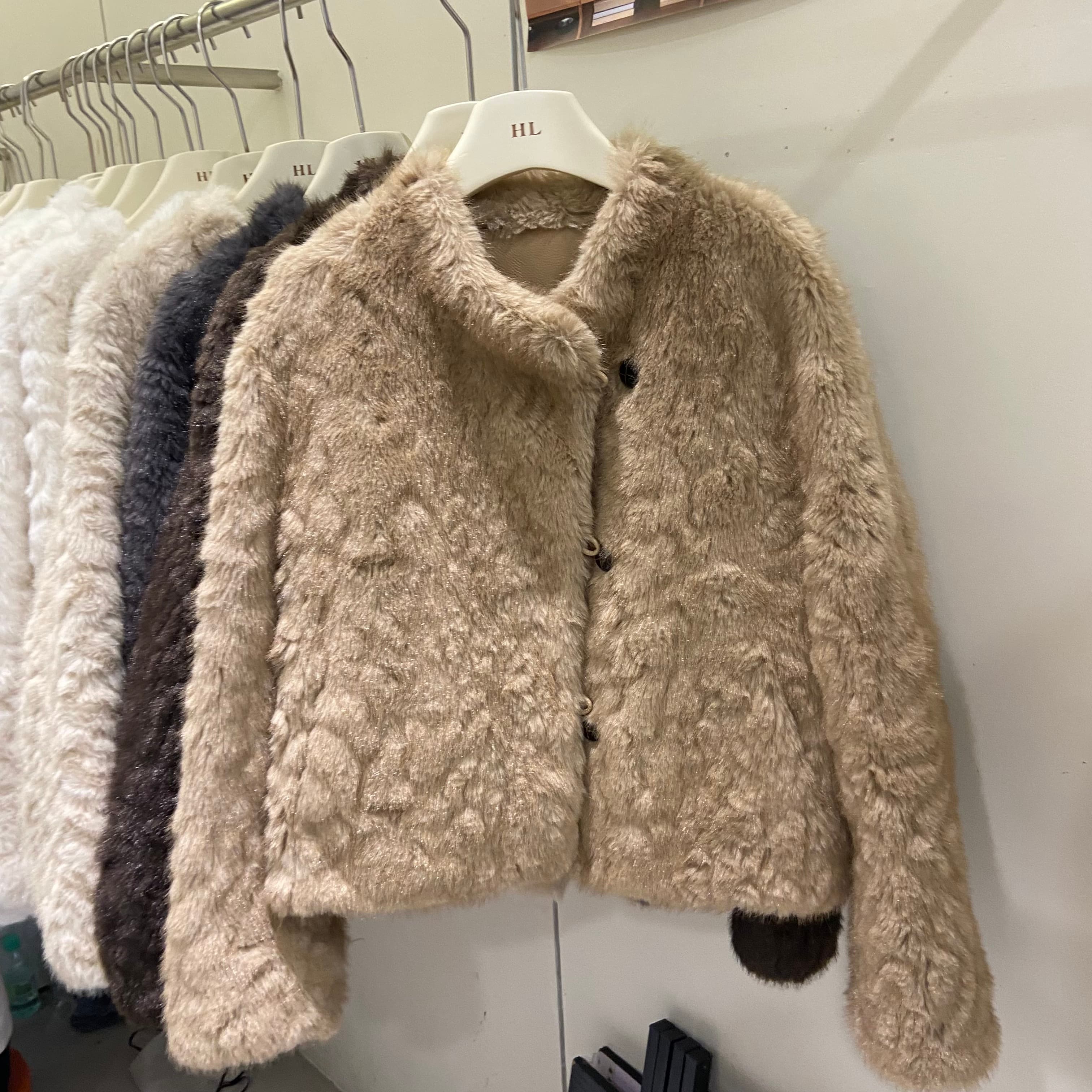 韩版小湖羊斜纽扣立领皮毛外套女