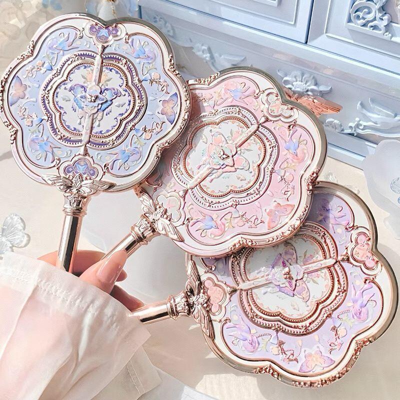 花知晓手持镜荷花粉色