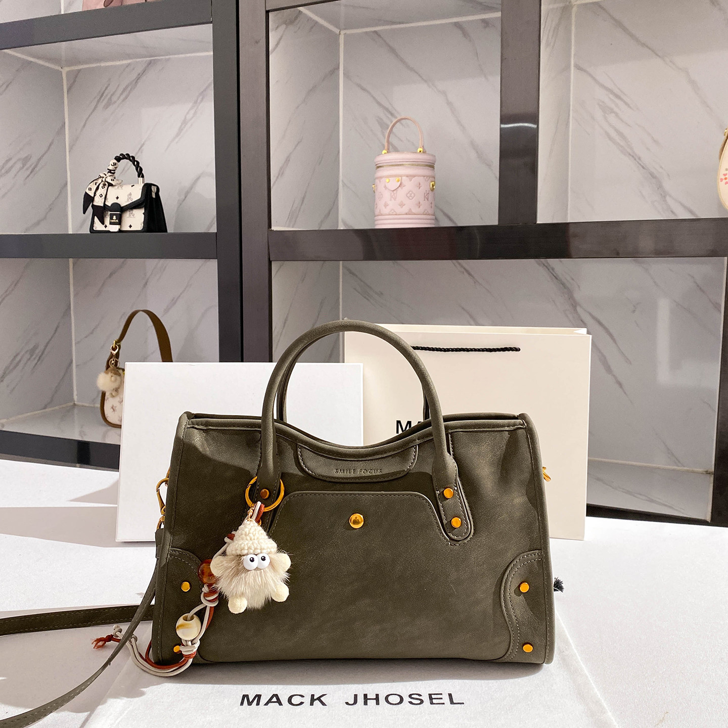 MACK JHOSEL复古流苏铆钉机车包包女士2026新款高级感通勤手提包