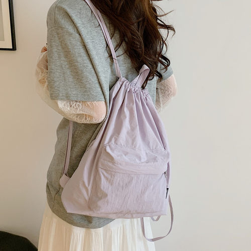 日系ins帆布抽绳双肩包女2026新款文艺简约休闲书包百搭旅行背包