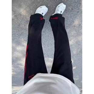 高级感斜杠条纹红黑撞色大码胖子牛仔裤小众韩版耐磨ins帅气长裤