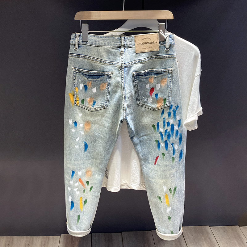 秋季浅色破洞牛仔裤修身小脚潮牌喷漆涂鸦复古做旧刮烂补丁长裤男
