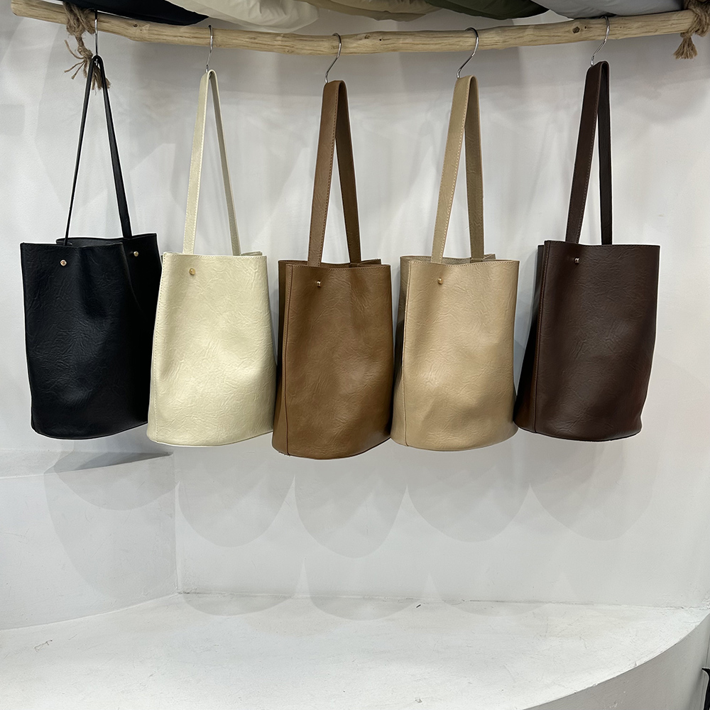 通勤水桶包百搭单肩腋下子母包