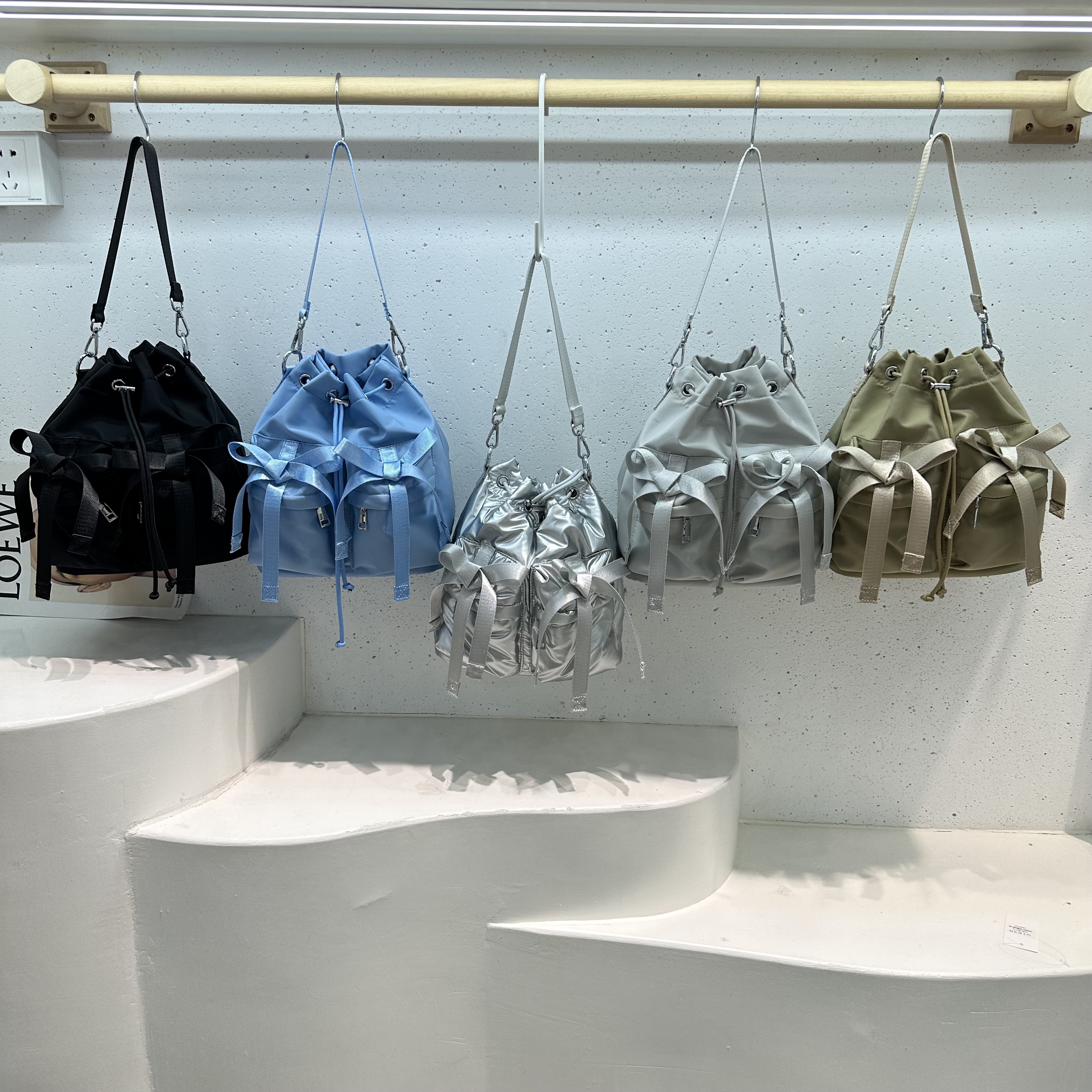 蝴蝶结设计抽绳个性单肩斜挎包