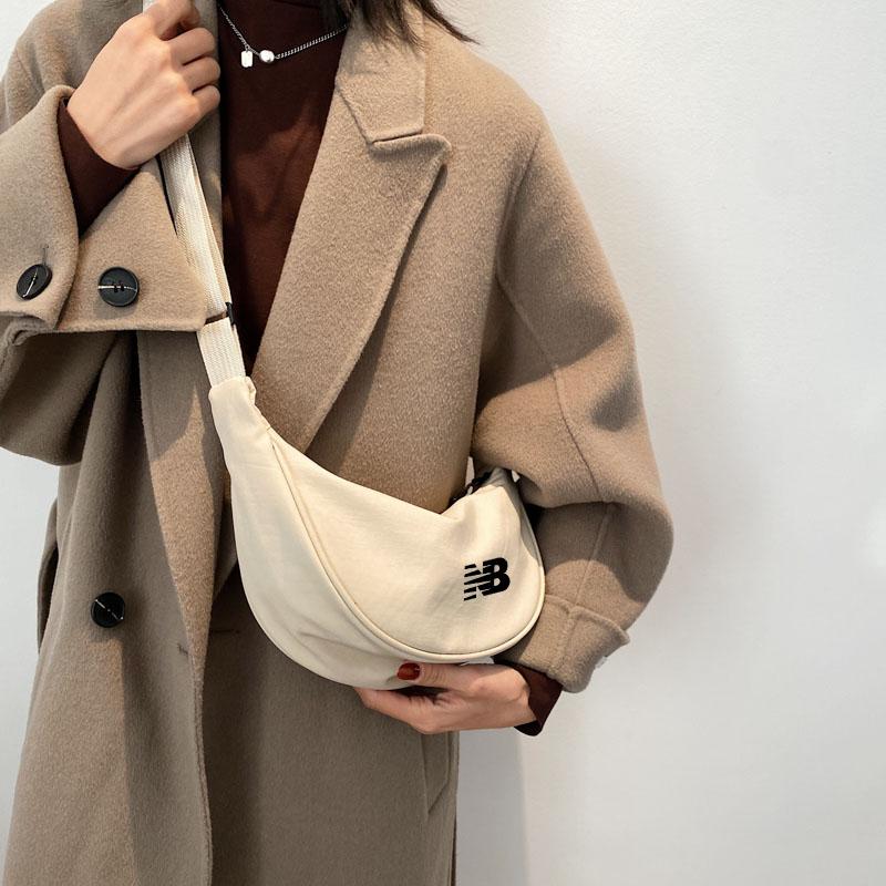 男女单肩背包收纳包腋下月牙包NB