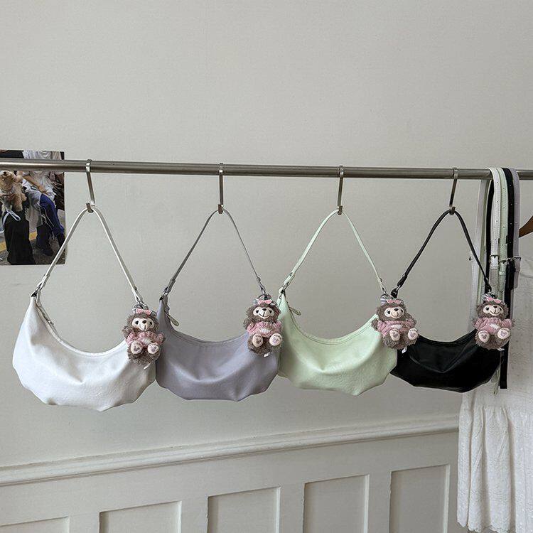 小白兔几百搭尼龙饺子纯色包女学生单肩斜挎腋下包轻便帆布包女