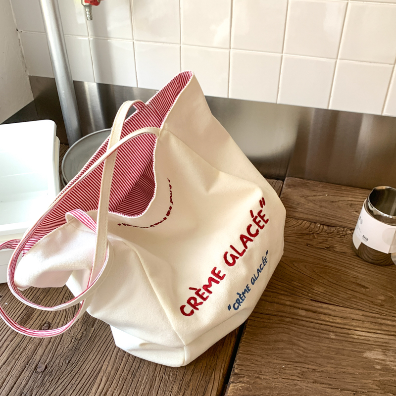 原创帆布包女2025新款大容量托特包双面刺绣休闲百搭大学生上课包