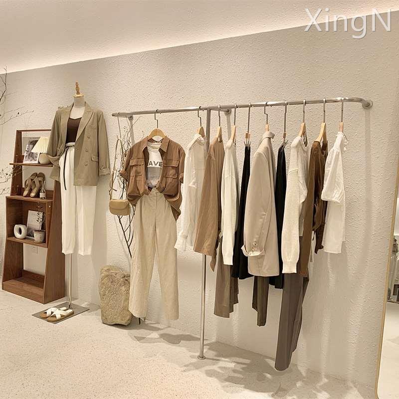 服装店展示架上墙女装店货架陈列架不锈钢拉丝货架落地式挂衣架