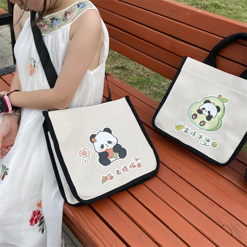 新款帆布包女手提包挎包饭盒便当小拎包上班外出简约百搭可爱卡通