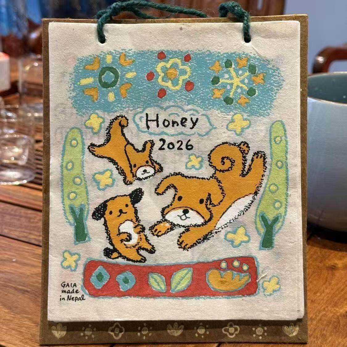 尼泊尔手工纸现货2026年新款小狗涂鸦日历插画台历装饰挂件桌面