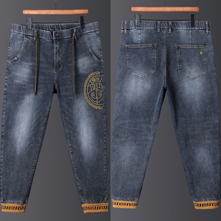 高弹大码牛仔裤男士青年修身束脚小脚裤加肥潮男哈伦裤4446码拼接