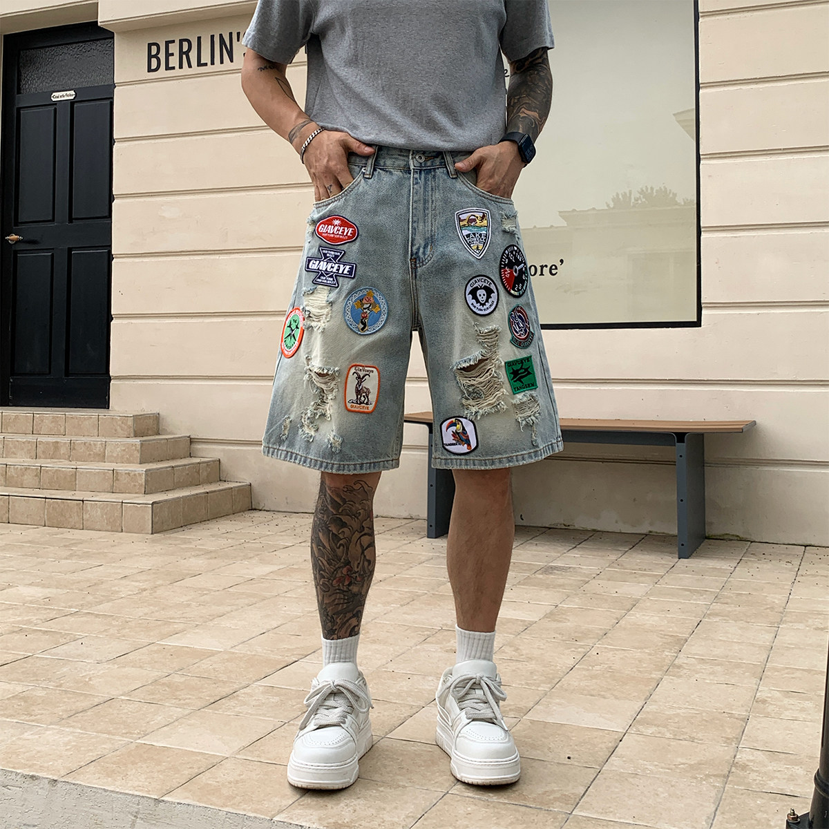 新款潮牌宽松短裤蓝色水洗破洞牛仔裤贴布男士夏季休闲做旧设计感