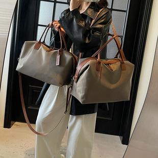 大容量尼龙布包包女2025新款百搭斜挎出差行李包高级感短途旅行包