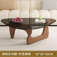 A modern and simple Nordic transparent and minimalist glass coffee table for home use in a small-sized living room. It is a creative round tea table by Isamu Noguchi thumbnail 5