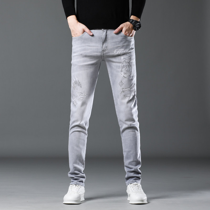 欧货高端烫钻牛仔裤男秋季潮牌灰白色弹力修身小脚休闲长裤子男款