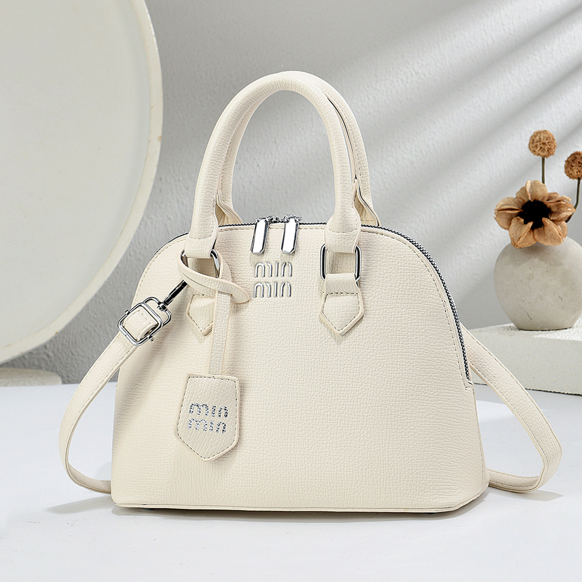 贝壳包包女斜挎2026新款小众设计高级感女士手提包简约单肩小拎包