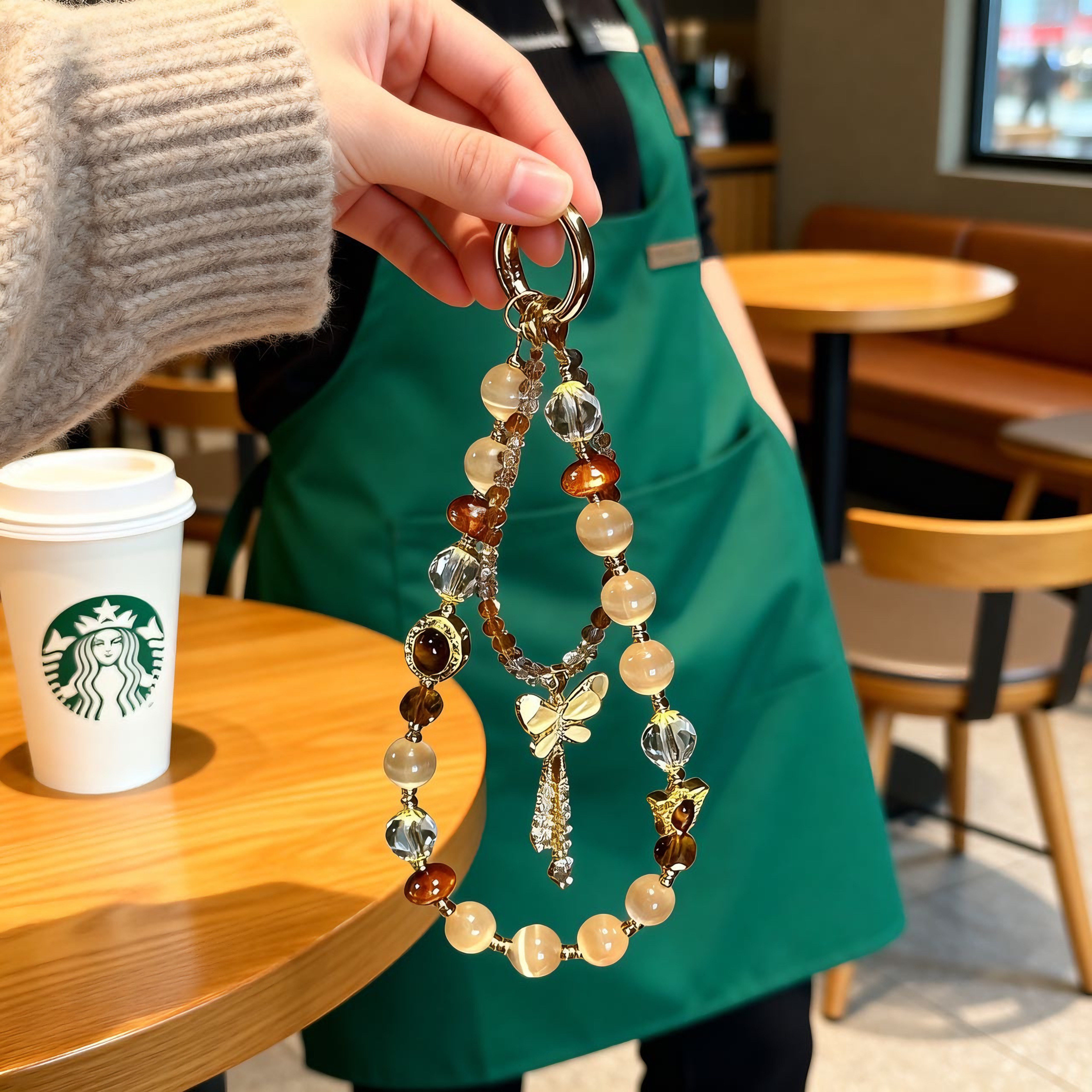 美拉德猫眼虎眼石水晶蝴蝶流苏手机链精致百搭包挂件ccd相机挂饰