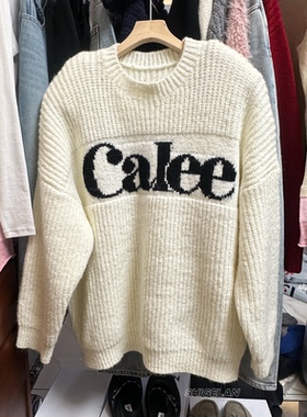 现货25538诗歌兰毛衣2025冬款 气质米白色字母垫肩中长款毛衣女