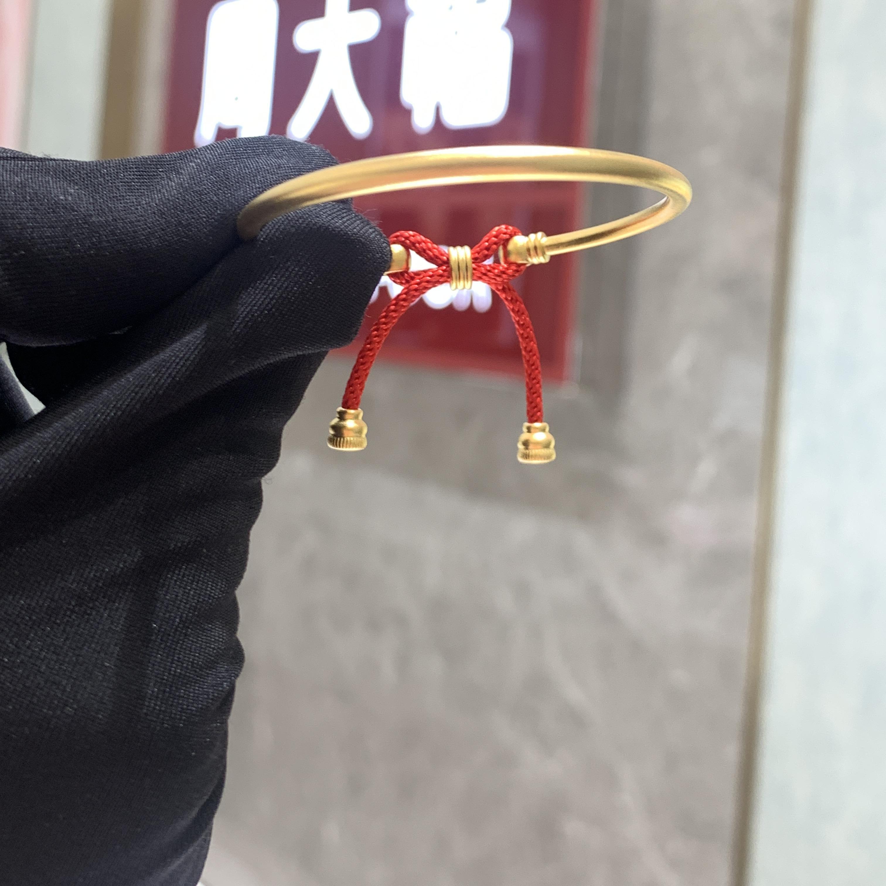 周大福红绳蝴蝶结宝宝黄金手镯