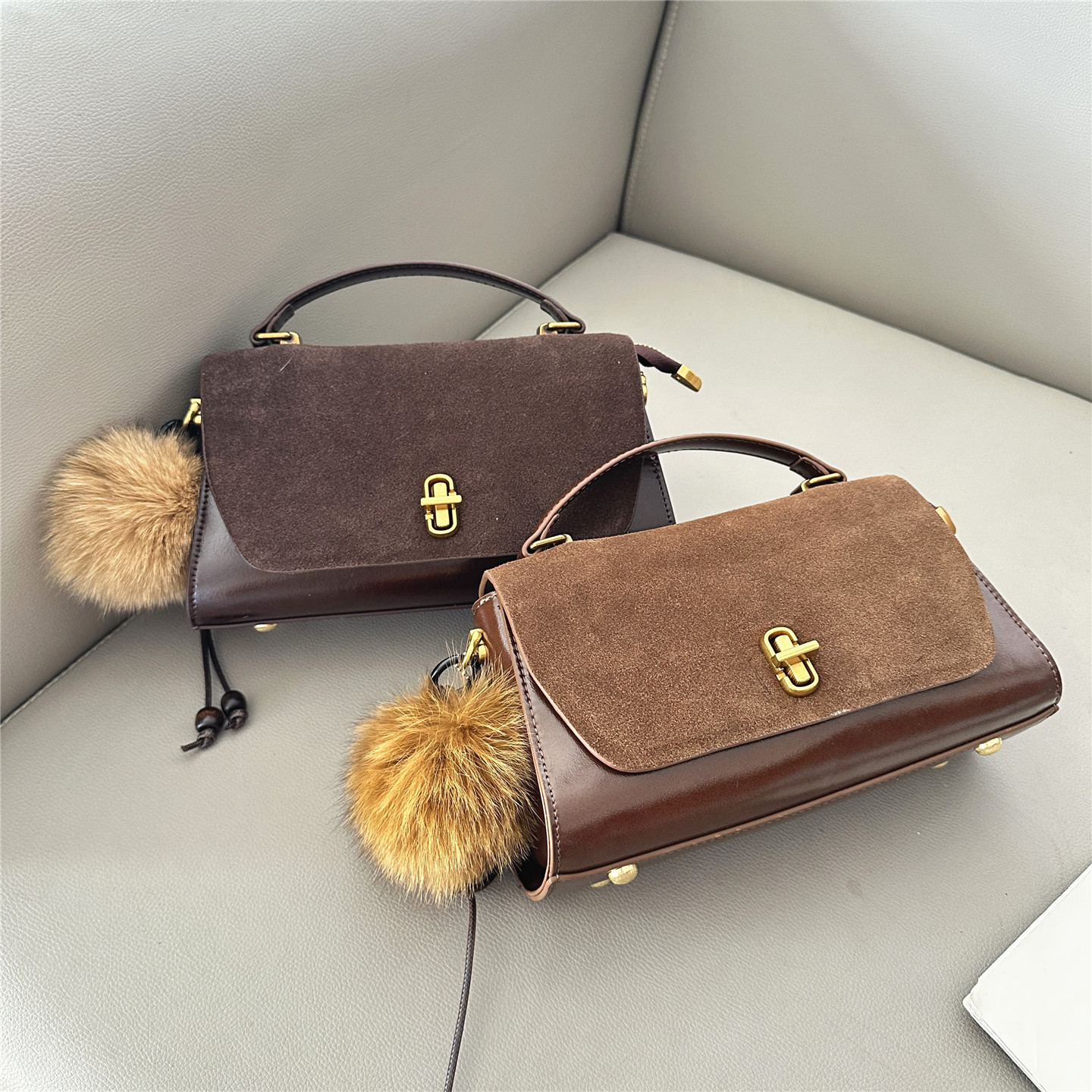 2025冬季新款时尚磨砂皮女包百搭单肩斜挎包手提小方包毛球装饰潮