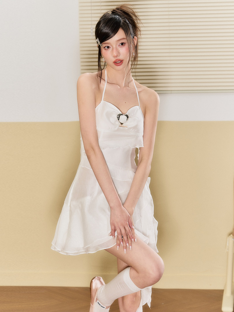 White halter mini dress worn by a model