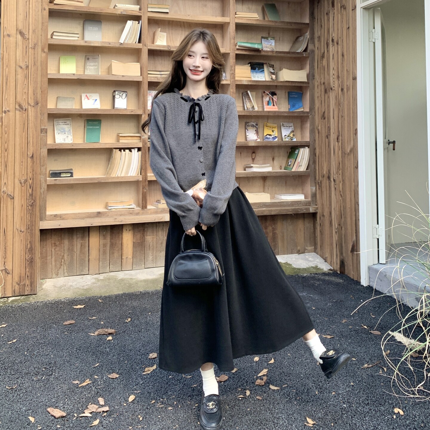 韩系温柔系穿搭套装女木耳边蝴蝶结针织开衫黑色A字半身裙两件套