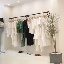 服装店上墙壁挂展架黑色挂衣架简约现代网红新款陈列架壁墙上货架