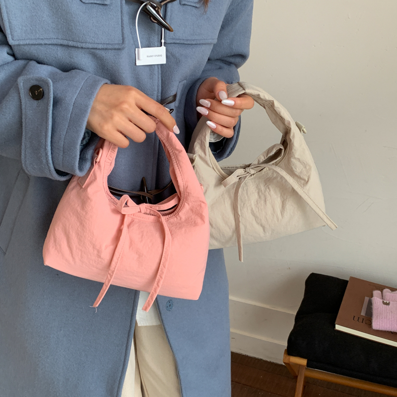 韩版简约手提水桶包包女式2025新款春夏时尚单肩包百搭通勤斜挎包