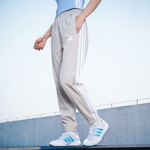 阿迪达斯梭织运动长裤女裤冬季款三条纹休闲裤束脚训练长裤JD6522