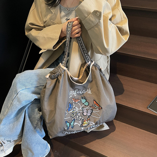 日系蝴蝶刺绣环保购物袋女式2025新款小众通勤手提包大容量单肩包