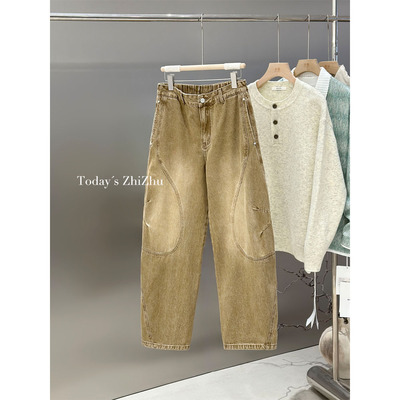 复古做旧拼接结构弯刀牛仔裤