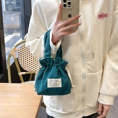 灯芯绒抽绳小手拎包迷你